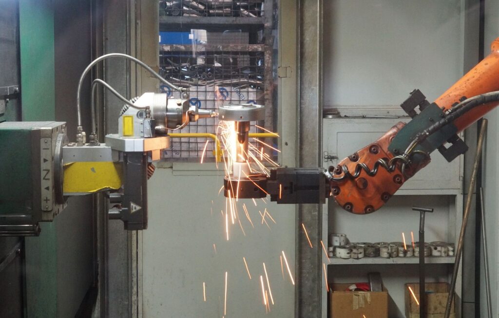 A robotic arm mid-task, representing software that decides and acts rather than only responding