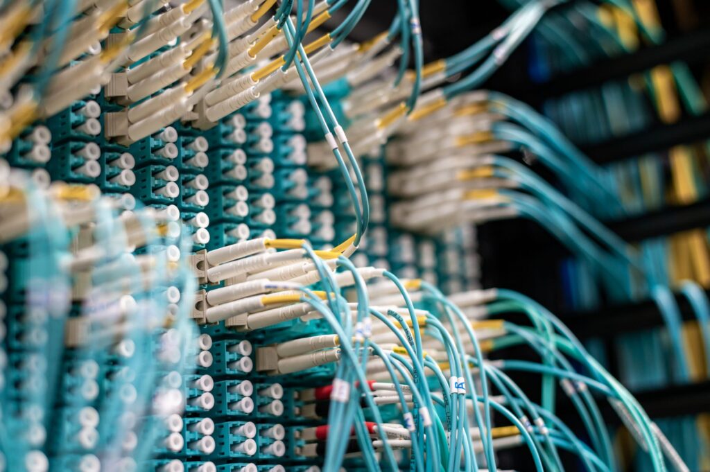 Network cabling in a server rack, representing a standard protocol connecting many systems